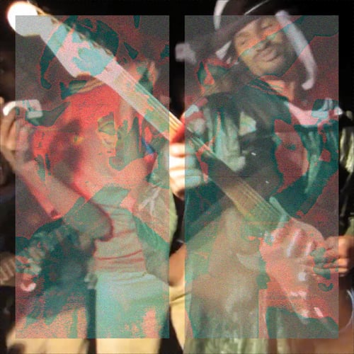 A square photograph, medium shot. Mdou Moctar playing an electric guitar wearing formal Saharan clothing, surrounded by people dancing. Outdoor in the dark with harsh lighting directed towards the activity. The image itself has two columns of distortion with intense fine colorful lime and magenta noise creating a ghostlike mirror image overlay.